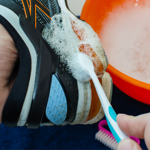 Cleaning trainers with a toothbrush